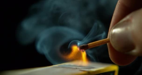 Match Smoke Hand Orange Flame Strike Ignite Studio Dark Background — Stock Video
