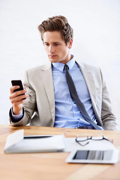 Businessman, phone and networking or email in office, connection and contact for company. Male person, professional and communication or mobile application, technology and smartphone for discussion.