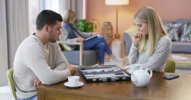 Siblings Thinking Playing Board Game Tea Living Room Fun Bonding — Stock Video