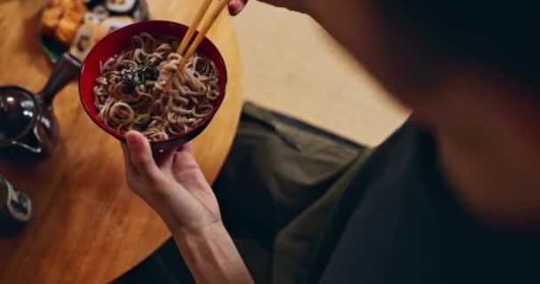 stock-video-closeup-bowl-noodles-hands-person