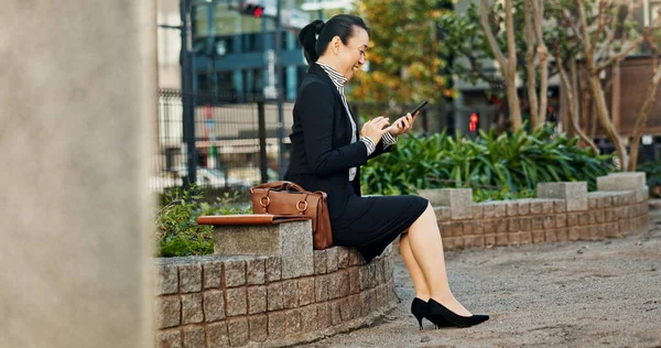 City, business and woman with smartphone, smile and typing with connection, online news and digital app. Japan, person and entrepreneur with cellphone, network and reading a blog with contact or text.