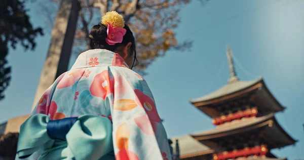 Woman, shinto temple and back with traditional clothes in culture, building or religion with vision for zen balance. Japanese girl, idea and buddhism in faith, mindfulness or walk on journey in Kyoto.