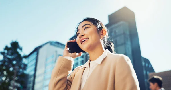 Happy woman, phone call and talking in city for communication, conversation or outdoor networking. Female person or employee smile on mobile smartphone for discussion, talk or chat in an urban town.