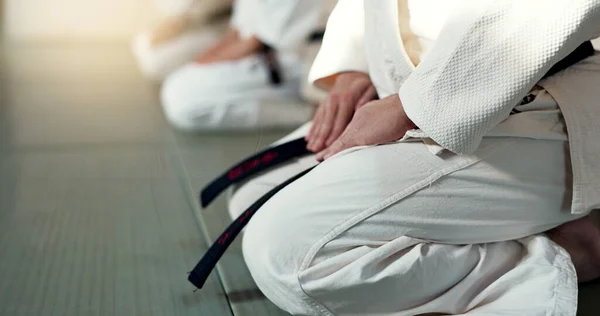 Japanese men, aikido and bow in training for fighting, modern martial arts and learning self defence. Group, black belt students or instruction in dojo place, sport or class in respect in discipline.