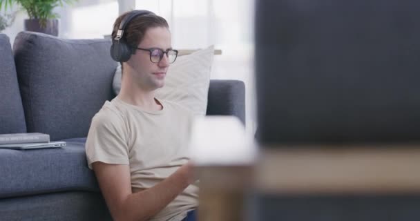 Man Listening Music Headphones Home Floor Smartphone Streaming Sofa Relax — Stock Video