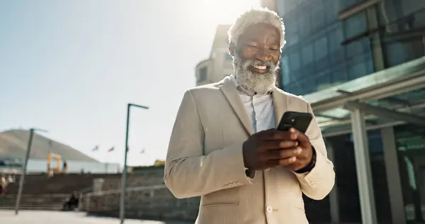 Outdoor, business or old man with cellphone, connection or mobile user with internet, typing and network. City, African person or employee with smartphone, mobile user or lens flare with social media.