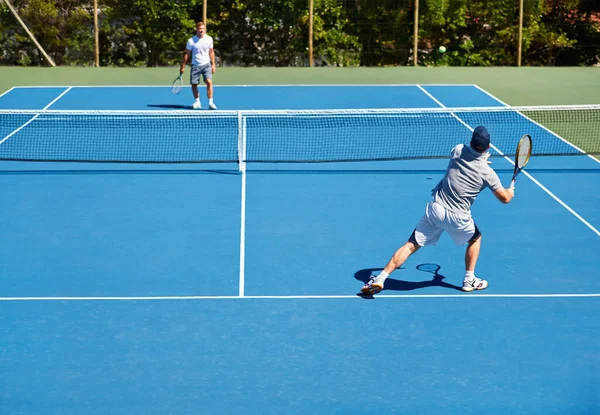 Tennis, match and men with fitness, sports and competition with training and cardio with a game. Players, friends and guys with rackets and court with workout and sunshine with challenge and practice.