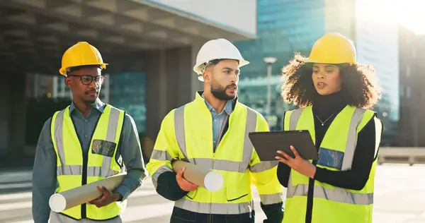People, architect and tablet in city planning for meeting, construction or building project on site. Group of employees, contractor or engineer in teamwork on technology for architecture plan or idea.