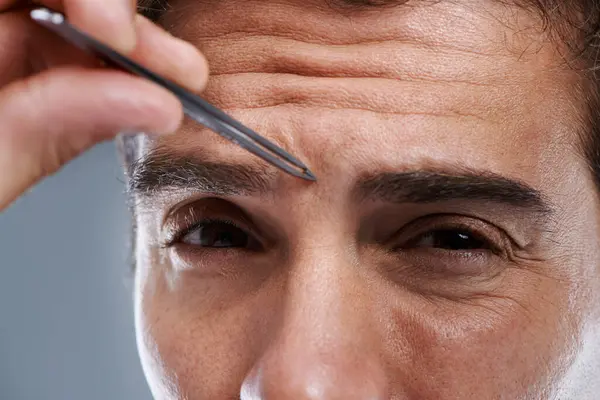 Man Portrait Tweezers Eyebrows Studio Face Grooming Hygiene Grey Background — Stock Photo, Image