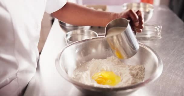 Hands Eggs Pouring Milk Flour Table Chef Process Dough Wheat — Stock Video