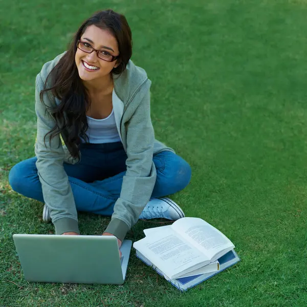 Woman, garden and laptop with notebook, glasses and computer for study, learning and college. Latino student, garden and technology for research, communication and university for online education.