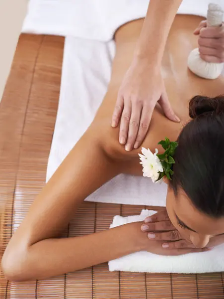 Relax, massage and woman with luxury, spa and stress relief with wellness and healthy skincare. People, customer and client with shine or glow with beauty or vacation with salon treatment or grooming.