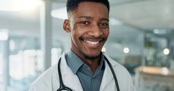 Hospital, doctor and face of African man for medical service, insurance and clinic care. Healthcare, consulting and portrait of health worker with stethoscope for cardiology, medicine and support.