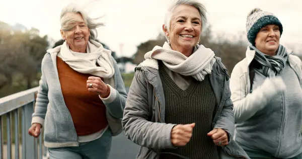 Senior friends, women and walking with fitness, exercise and fresh air with happiness, wellness and health. Female people, mature ladies and group with speed walk, training and energy with freedom.