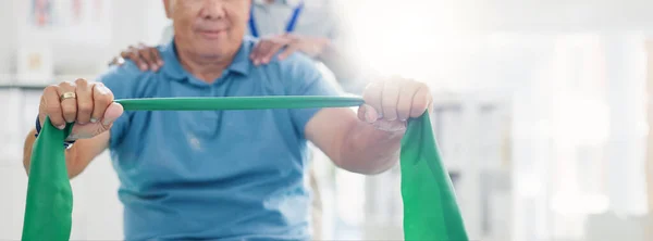 Resistance band, physical therapy and old man with physiotherapist, muscle training and strength with senior care. Health, wellness and people at physio clinic with rehabilitation and equipment.