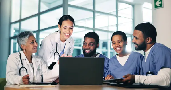 Healthcare, meeting and doctors, nurses and laptop in office with documents for medical compliance, surgery or planning. Hospital, team or people online for brainstorming, solution or problem solving.