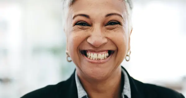 Senior woman, business ceo closeup and laughing face in a office with consultant manager confidence. Funny, comedy and happy professional employee at a company job at consultation agency with smile.