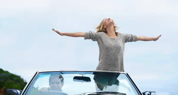 Man Driving Convertible Woman Freedom Arms Road Trip Travel Adventure — Stock Photo, Image