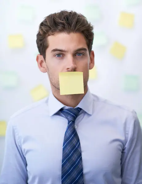 Businessman, portrait and sticky note on mouth or corporate schedule or to do list, project planning or censored. Male person, paper and face or reminder for professional, brainstorming or deadline.