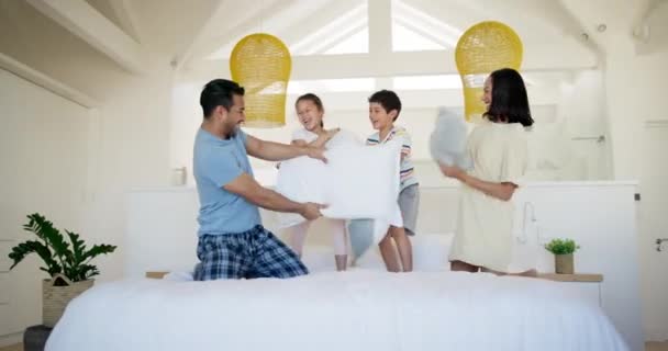 Children Mother Father Pillow Fight Bed Laugh Playful Bonding Holiday — Stock Video