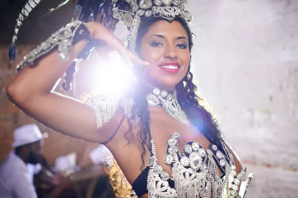 Culture, dance and portrait of woman at carnival with costume for celebration, music and happy performance in Brazil. Samba, party and girl at festival, parade or show in Rio de Janeiro with smile