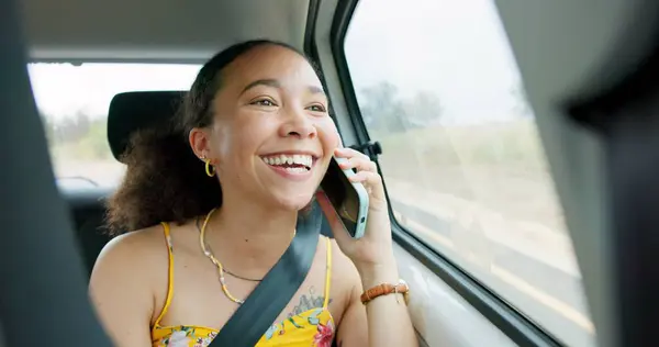 Woman, phone call and road trip in car with laugh, chat or conversation by window, journey or travel. Girl, smartphone and talking with thinking, funny story and street for transportation on holiday.
