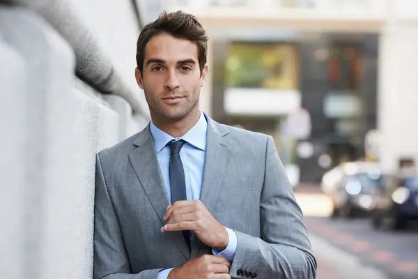 Happy, pride and portrait of businessman in city with positive, good and confident attitude. Smile, suit and handsome professional male accountant with classy and elegant style in urban town