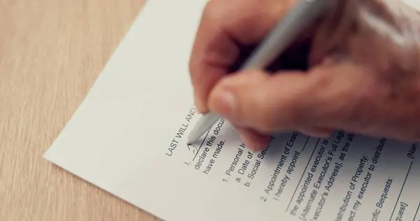 Hands, writing or old person with will, contract or application or document for insurance and title deed agreement. Compliance, closeup or elderly client signature for paperwork, pen and legal form.
