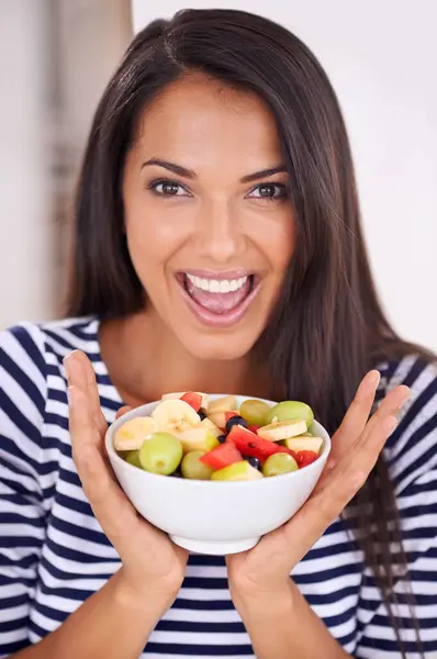 Portrait, woman and excited for fruit bowl, natural nutrition and healthy organic food. Happy, female person with snack with vitamins for skin and wellness, balance diet and salad with vegan choice.