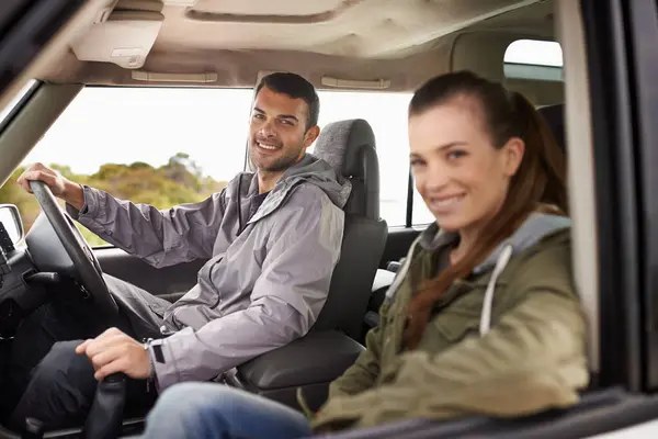 Couple, man and portrait on road trip with travel for adventure, vacation and anniversary getaway with happiness in nature. Woman, car and driving in vehicle for holiday journey, tourism or honeymoon.