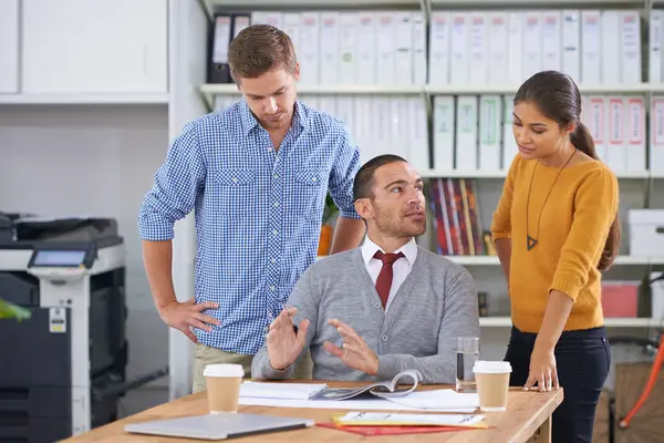 stock image Business people, journalism and conversation with brainstorming and discussion for a project launch. Designer, manager or employees with editing or teamwork with cooperation, ideas or magazine layout.