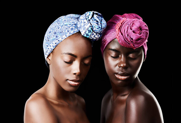 African, head scarf and women in studio for wellness, health and hair care treatment. Natural beauty, salon aesthetic and people with friends, cosmetics and makeup for culture on black background.