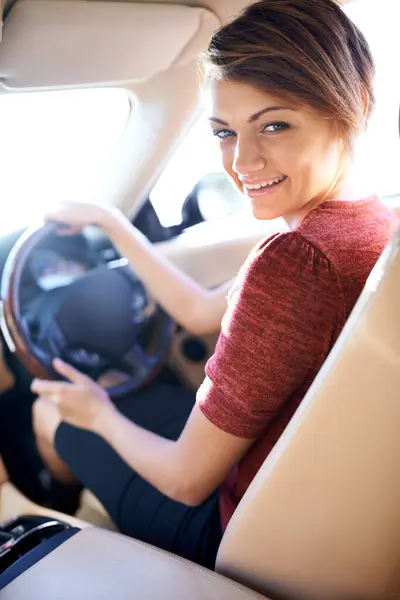 Portrait, driving and business woman with smile on morning commute, road trip or journey to work. Travel, transport and happy driver at wheel of car with confidence, test drive and auto insurance