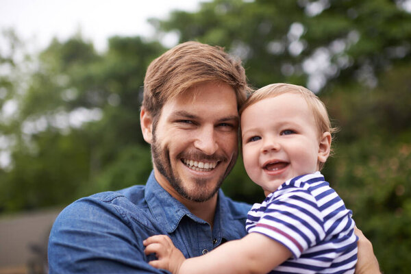 Portrait, smile or father with toddler in outdoor, love or together in nature for child growth or development. Happy family, dad or holding kid for bonding, face or responsibility for son on weekend.