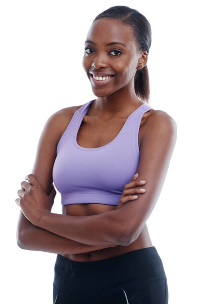 Portrait, fitness and arms crossed with happy black woman in studio isolated on white background for health. Exercise, smile and workout with confident young sports model training for improvement.