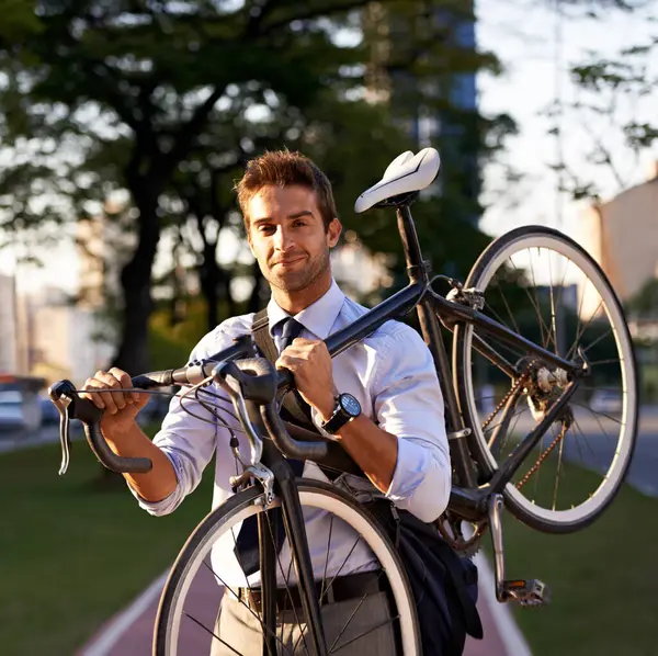 Bicycle, portrait and business man for commute, transportation and carbon neutral in city. Professional, sustainable and face of male employee walking with bike for travel, journey or eco friendly.