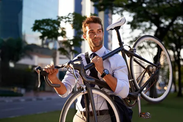 Morning, businessman and bicycle for sustainable travel, transportation and carbon footprint in city. Professional, commute and male employee walking with bike for cycling, journey or eco friendly.