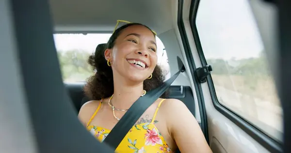 Woman, car and road trip with laugh by window with thinking, ideas and comic memory for vacation travel. Girl, person and happy in vehicle with smile to remember funny story with driving on road.