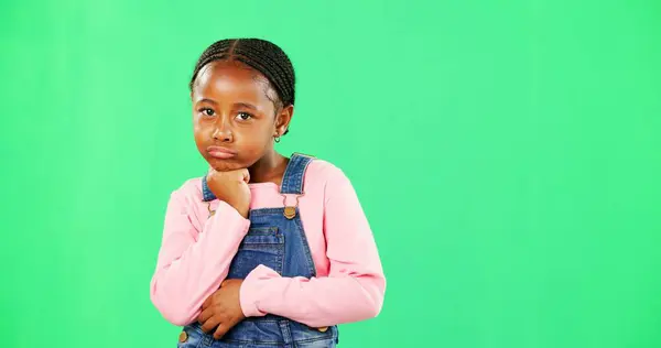 Girl, child and attitude in portrait by green screen with space, promotion or pout lips with fashion. African kid, angry and frustrated with emotion, chromakey or annoyed in mockup for trendy clothes.