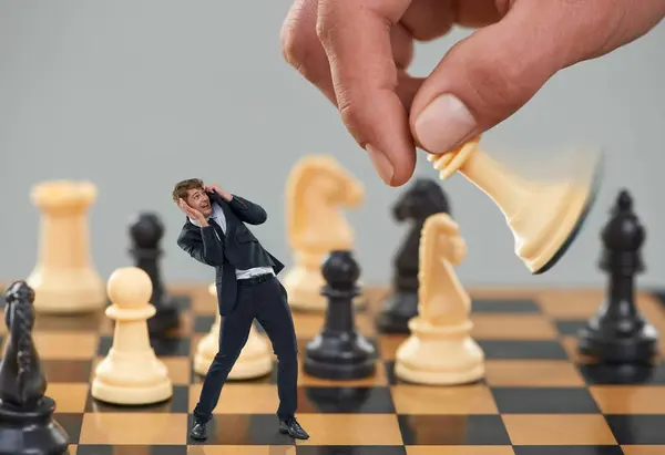 Man, business and chess with strategy, risk and fear for career safety or attack. Worker, scared and corporate with competition, debt and shouting from terror with pawn overwhelmed with job security.
