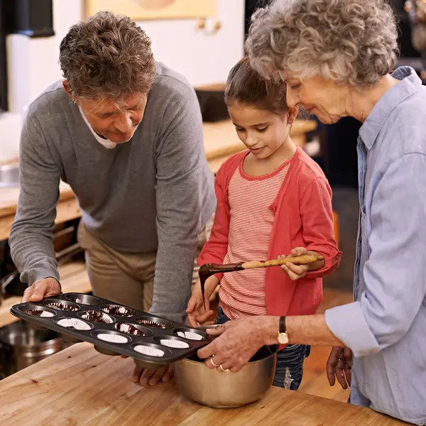 Child Grandparents Baking Cupcakes Kitchen Bonding Together Mature Woman Smile — Stock Photo, Image