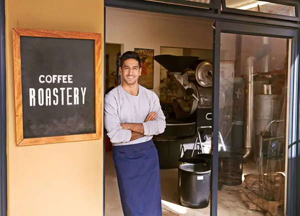 Barista, coffee shop and man in portrait for small business, owner with arms crossed and smile for service. Entrepreneur, cafe and drink store with hospitality, professional and server in industry.