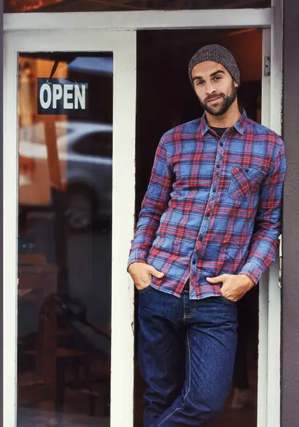 Small business, restaurant and portrait of man with sign at entrance of cafe with smile. Open, confidence and entrepreneur at coffee shop with career in service, hospitality and happiness at door.