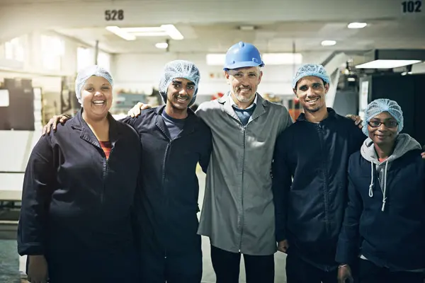 Portrait, team or factory as teamwork, industry or manufacturing in safety, ppe or order fulfillment. Happy, manager or staff in workwear, industrial or trade at production plant by collaboration.