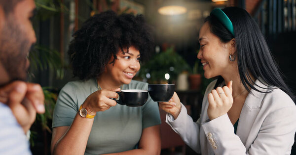 Happy people, friends and talking with coffee at cafe for social, free time or catch up break together. Group smile and enjoying conversation with beverage, drink or cup of tea at indoor restaurant.