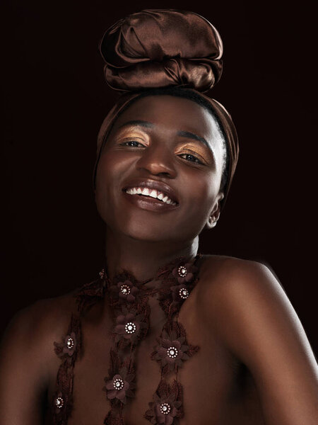 Smile, wrap and portrait of black woman in studio for fashion, natural beauty and makeup on dark background. Happy, cosmetics and African model with traditional head scarf, accessories or glamour.