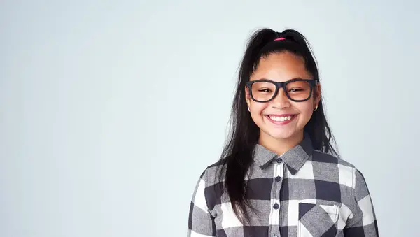 Portrait Girl Kid Glasses Student Confident Geek Blue Studio Background — стоковое фото