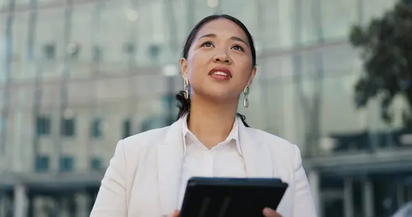 City, tablet and thinking with business asian woman outdoor in summer for morning commute or research. Idea, internet and social media with confident young corporate employee in urban town for travel.