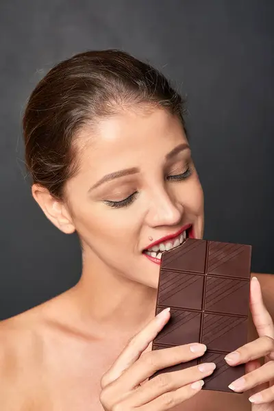 Chocolate Bite Woman Studio Eating Unhealthy Diet Sugar Craving Cheat — Stock Photo, Image