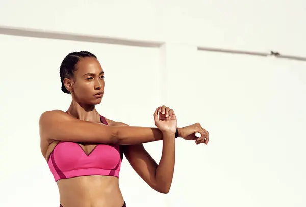 Stock image Woman, fitness and stretching outdoor for wellness, health and training for sports competition. Exercise, workout and sunshine for mockup at outside gym for athlete, sweat and body for summer goals.